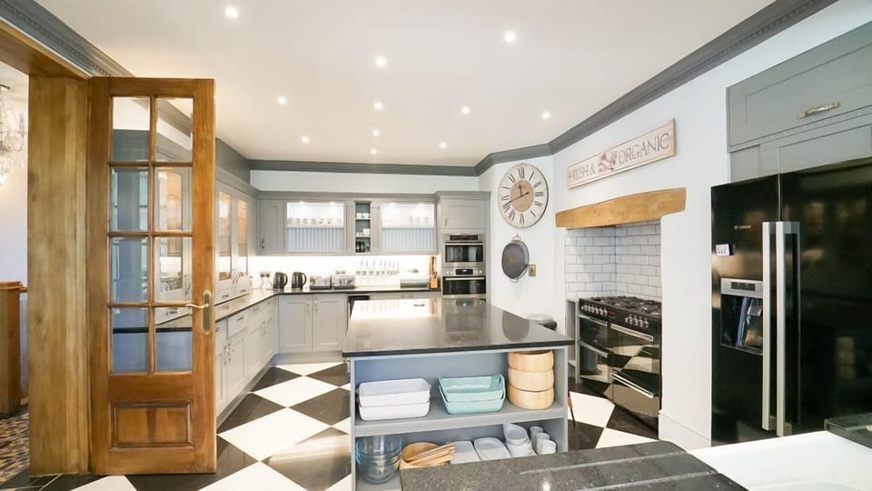 The kitchen adjoins the light filled dining area
