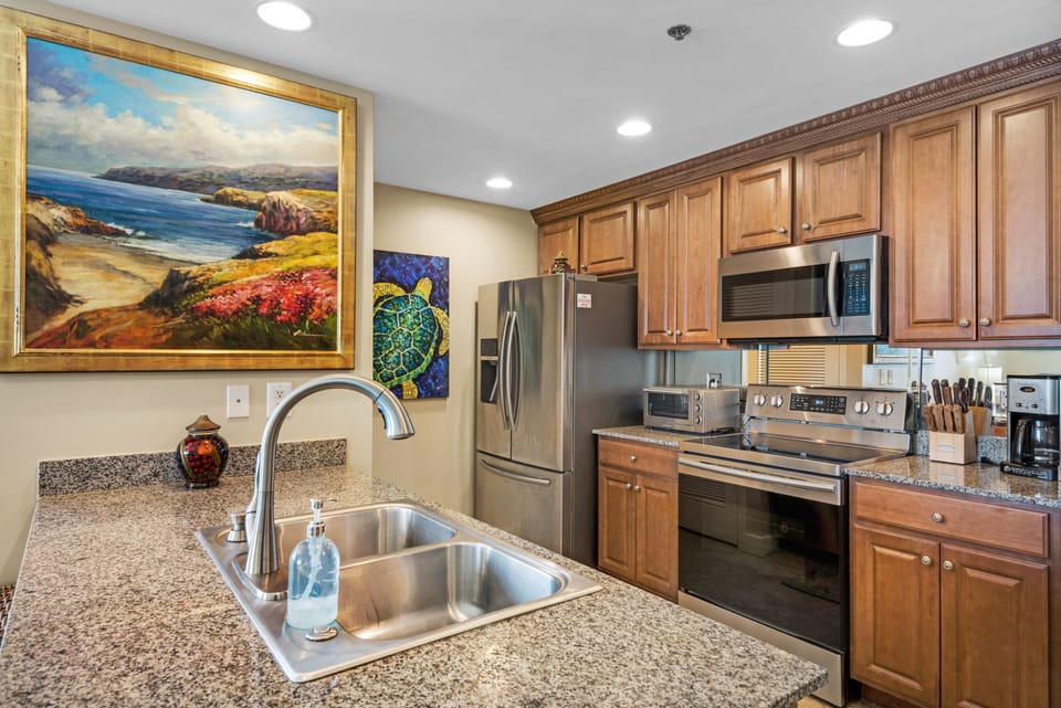 Kitchen, with crown molding, granite counters & all stainless steel appliances.