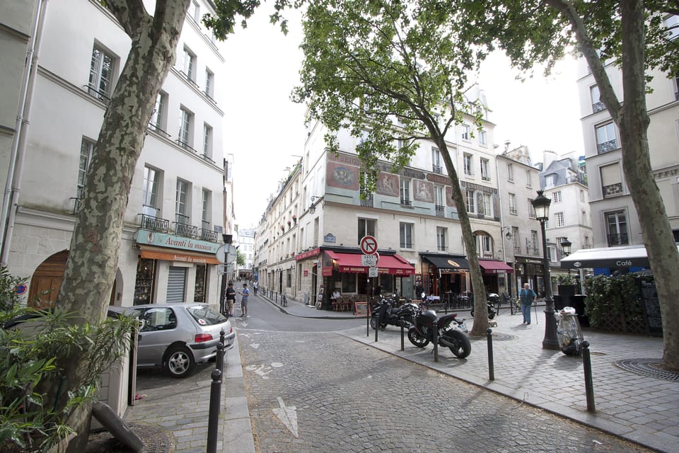 Charming square at end street onto river Seine