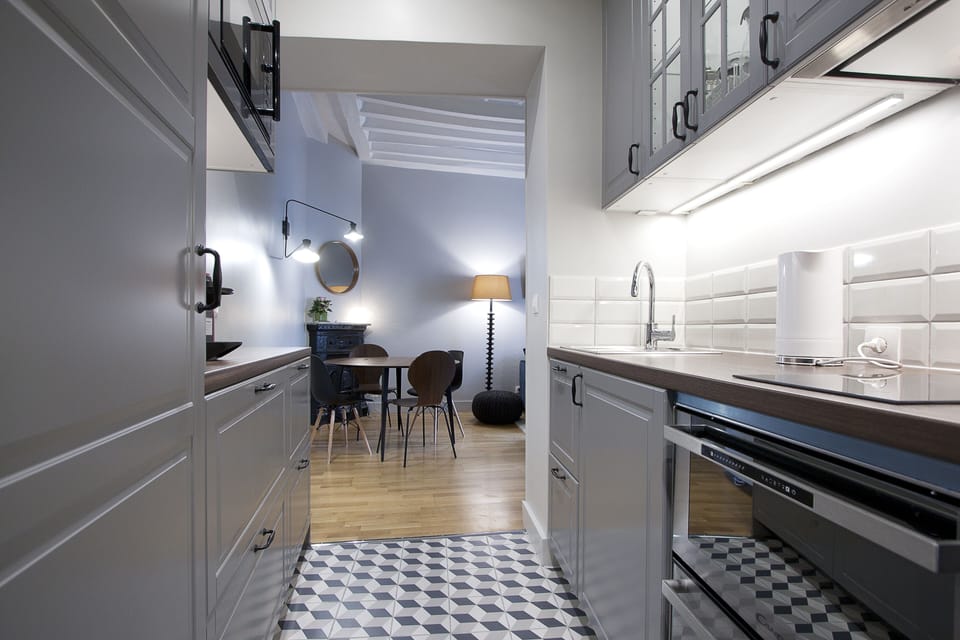 From kitchen fully equipped to dining room and living room