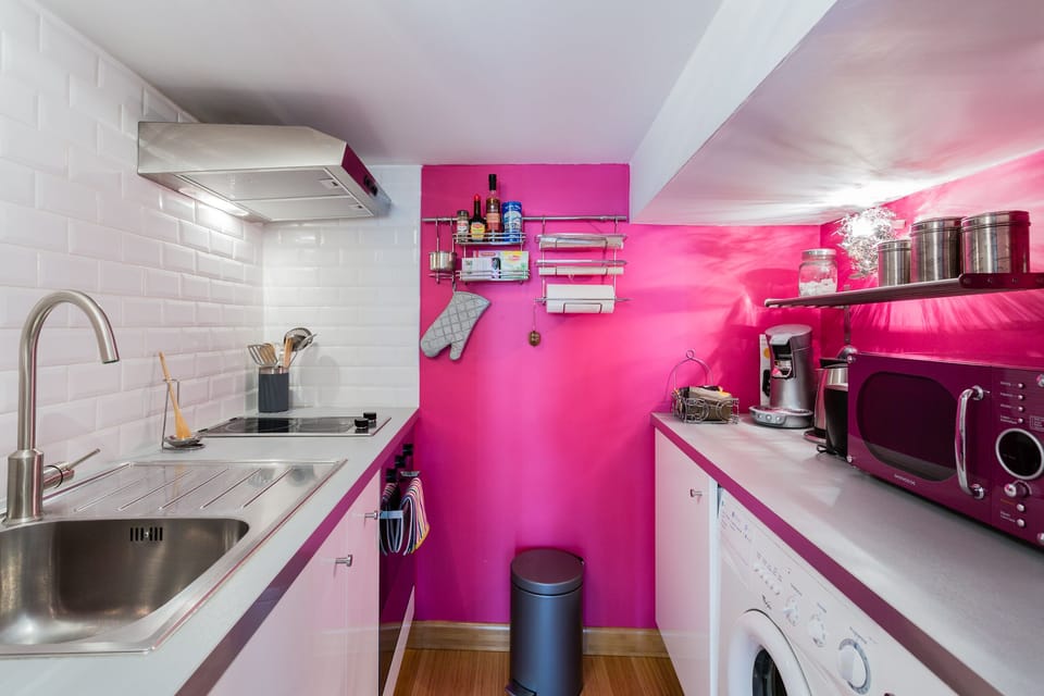 A small but functional kitchen where you can prepare your meals, do laundry 