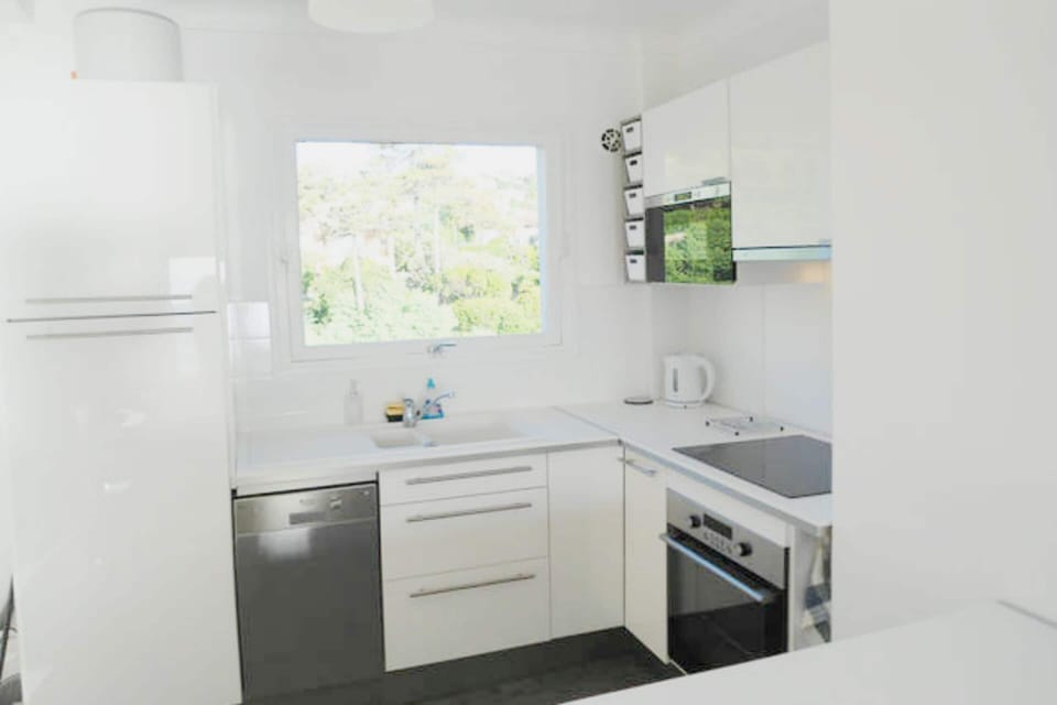 kitchen, sink and back view over trees