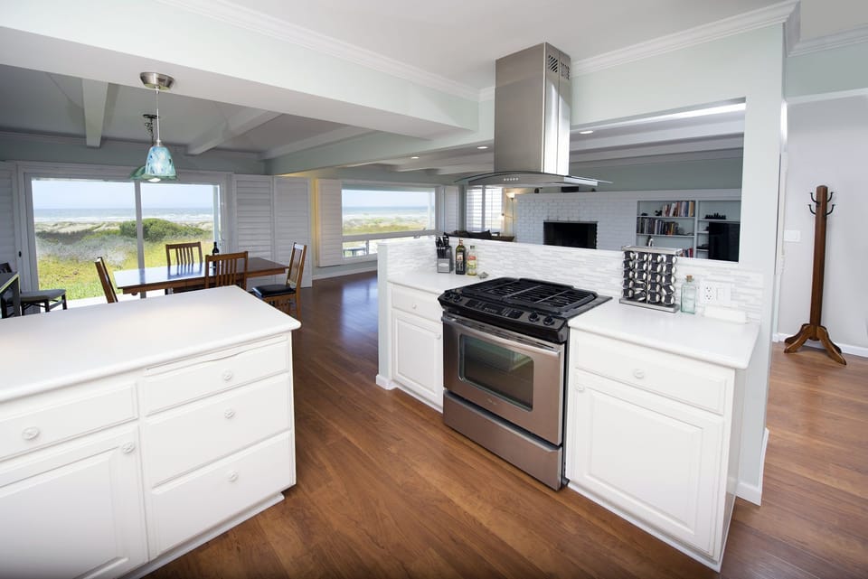 The kitchen includes high end appliances and a gas stove.