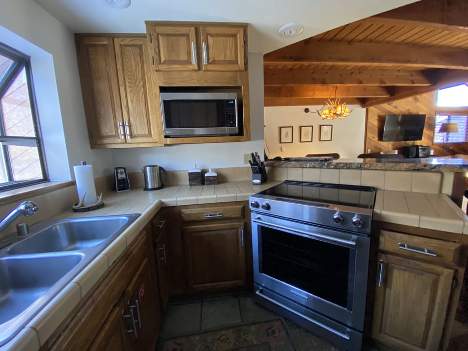 Kitchen - fully stocked for cooking needs! (2nd floor).
