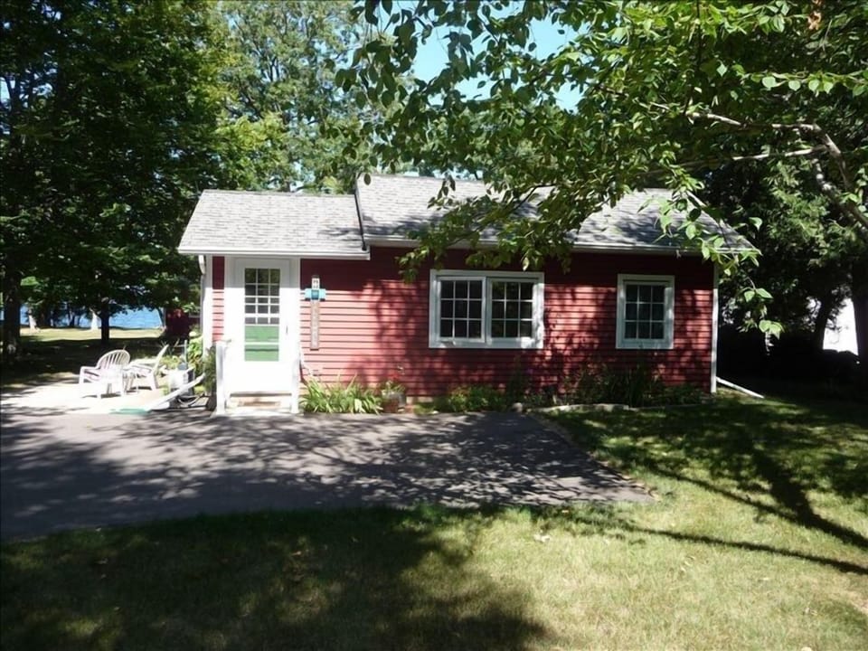 front view of cottage- you can see Green Bay in the background
