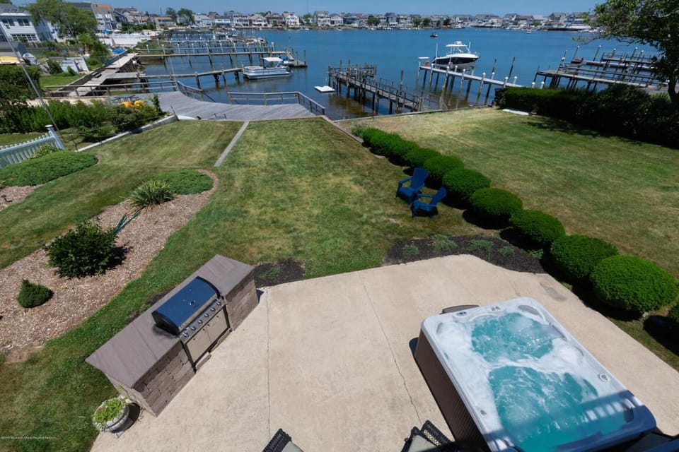 Brand new seven (7) person hot tub with the water view