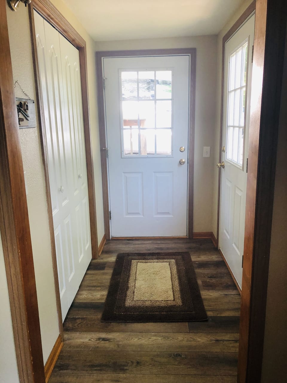 Closed in front porch with a sitting room and stereo and games.