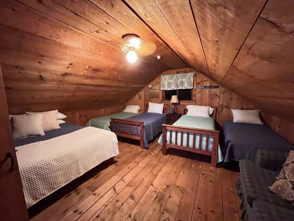 Upstairs Bedroom to Left
(4 Twin Beds and 1 Queen Bed)