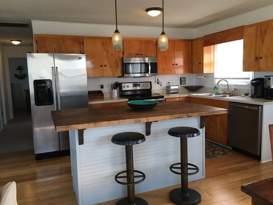 Full, well appointed  kitchen with island seating.