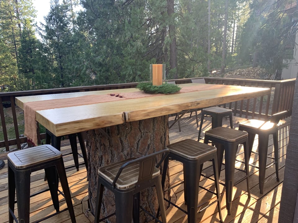 Pine table seats up to 10 on back patio