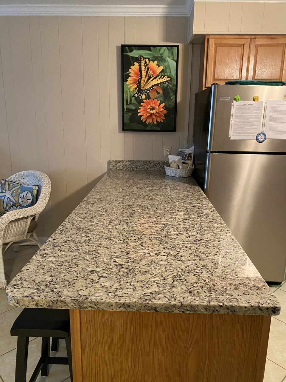 Extra wide and long countertop with storage cabinets on both sides.