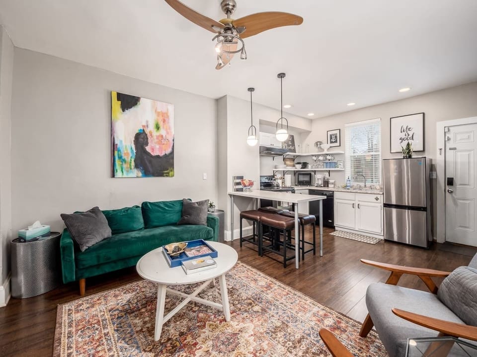 Living room has a smart TV ready for your streaming services!