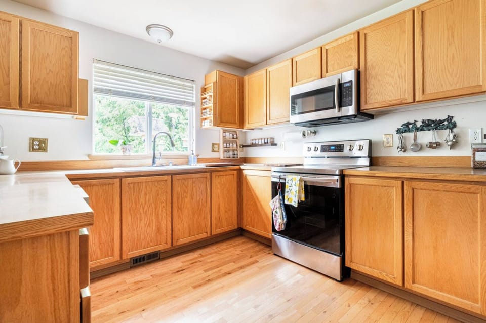 The kitchen is fully equipped with gourmet pots and pans.