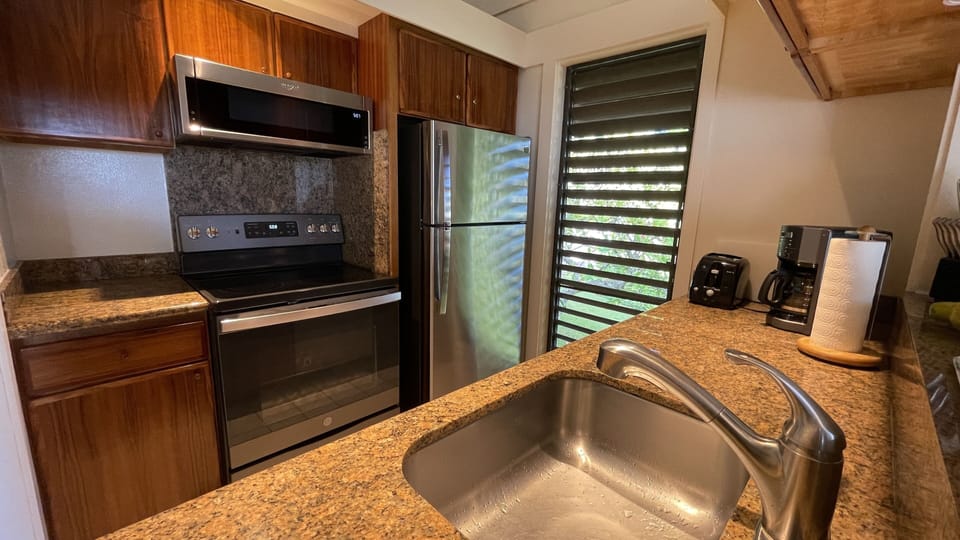 Full kitchen with koa cabinetry