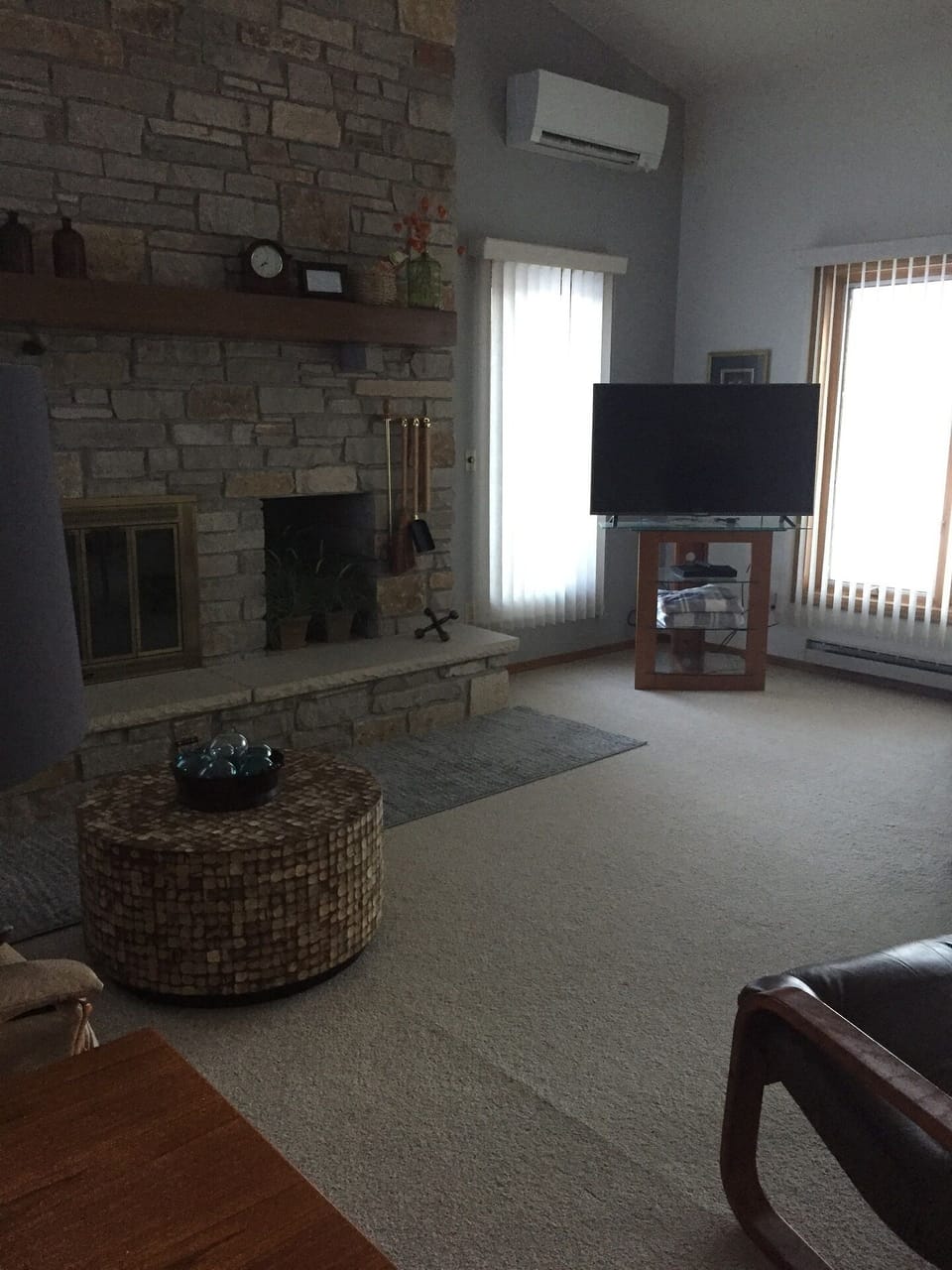 VAULTED LIVING ROOM WITH WOOD BURNING FIREPLACE