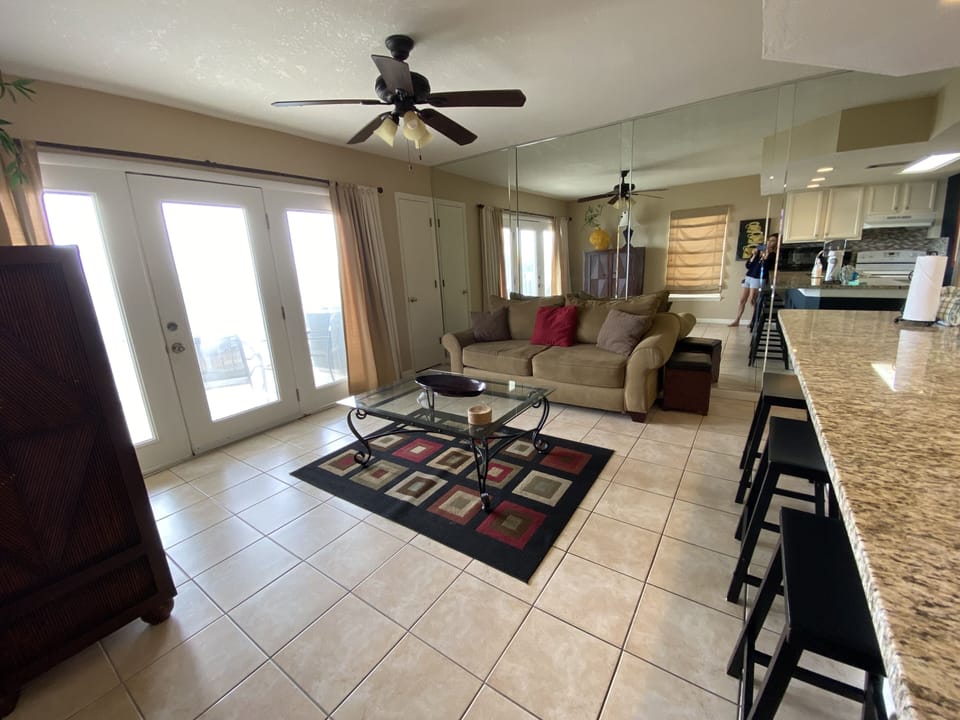 Relax in our spacious living room with a sofa sleeper couch, TV and balcony door