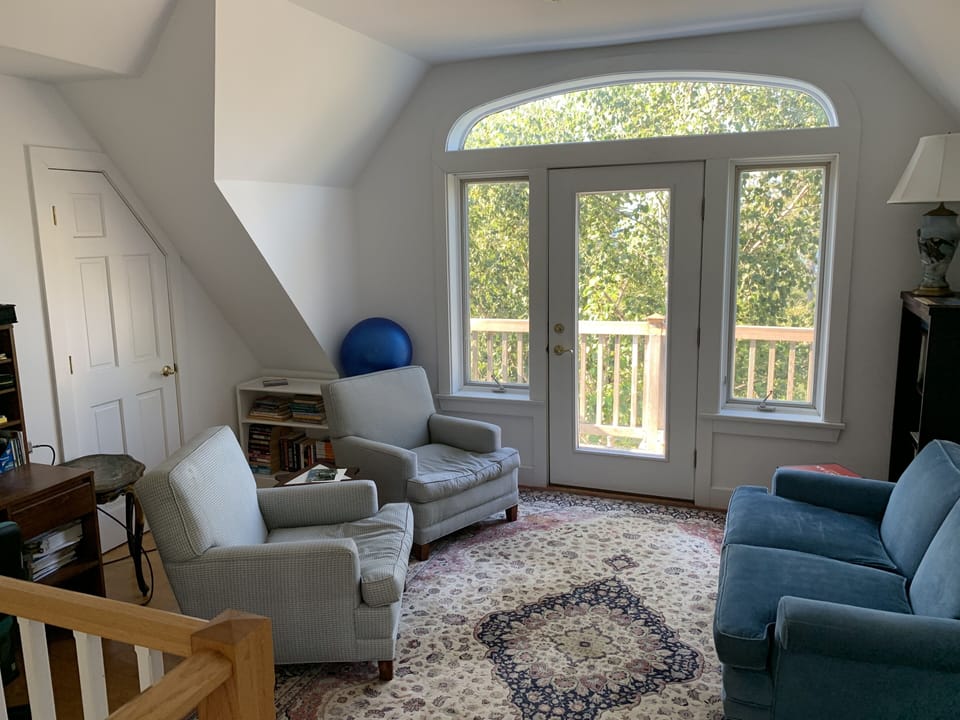 Welcoming sitting area with walk out balcony outside master bedroom.