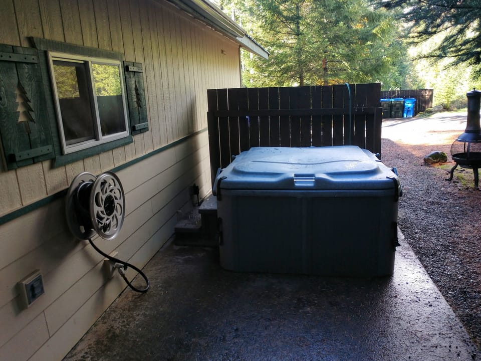 View from back door w/hot tub. Chimenea damaged & subsequently removed