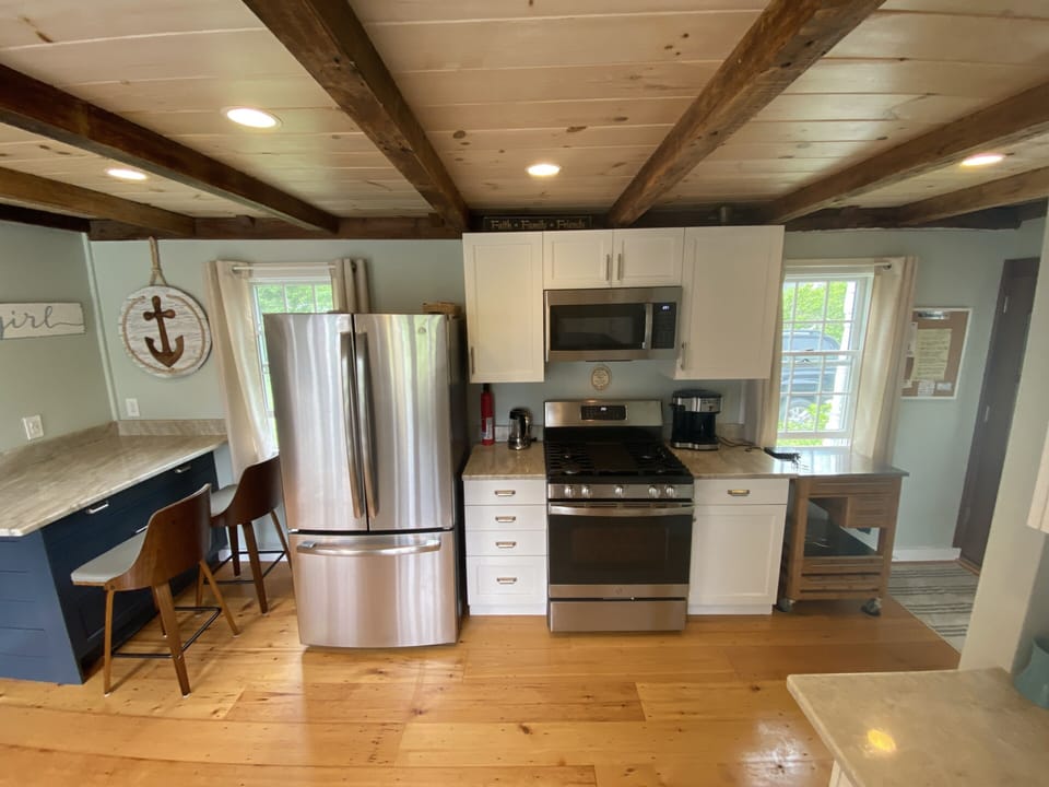 Kitchen Island, refinished hardwood flooring. Wine cart