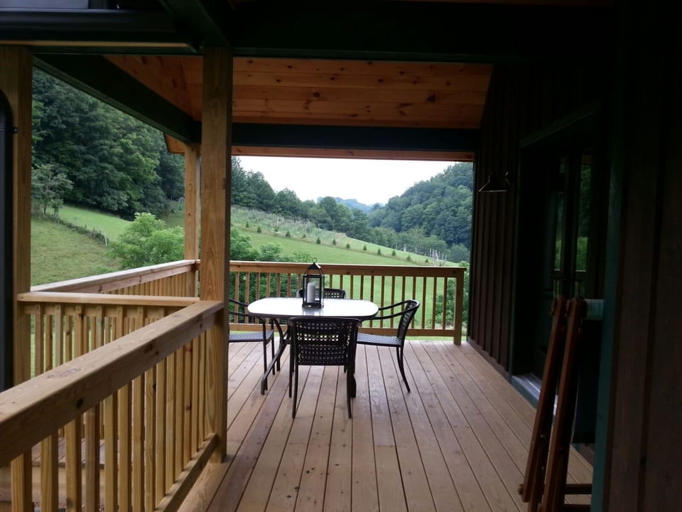 Outside dining just off the kitchen with view of apple orchard and pasture.