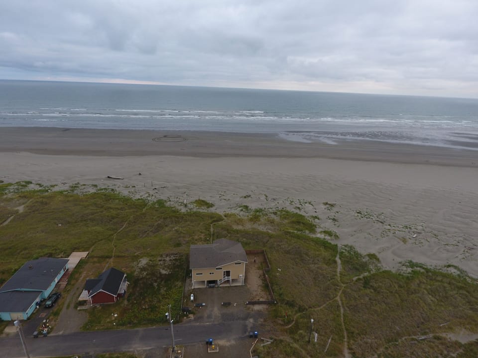 Aerial perspective from behind house out to ocean