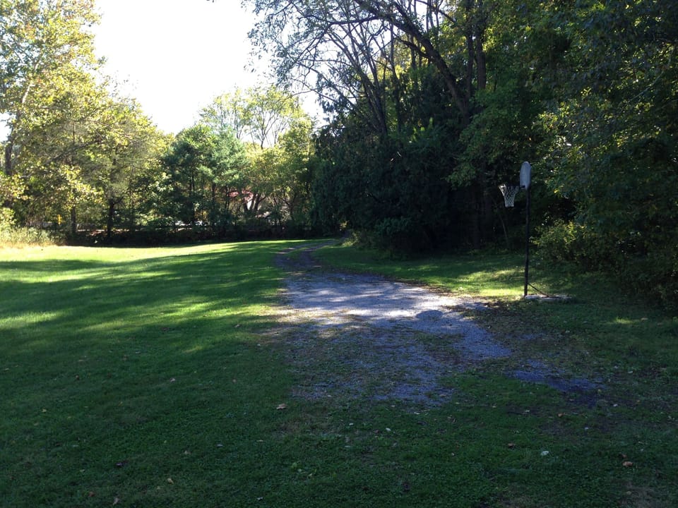 Deck view of basketball goal in driveway