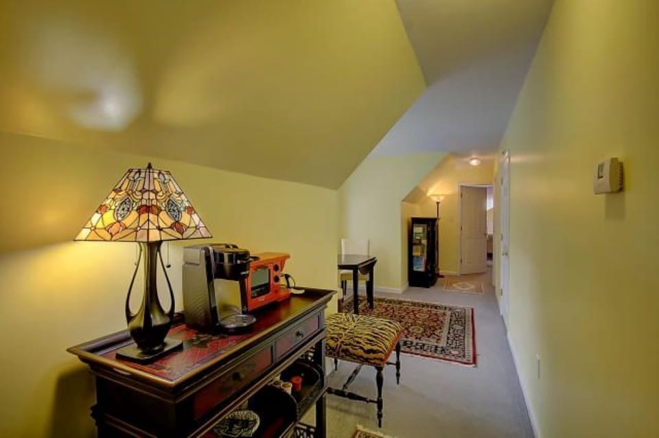 Upstairs hallway with fridge and kitchenette amenities