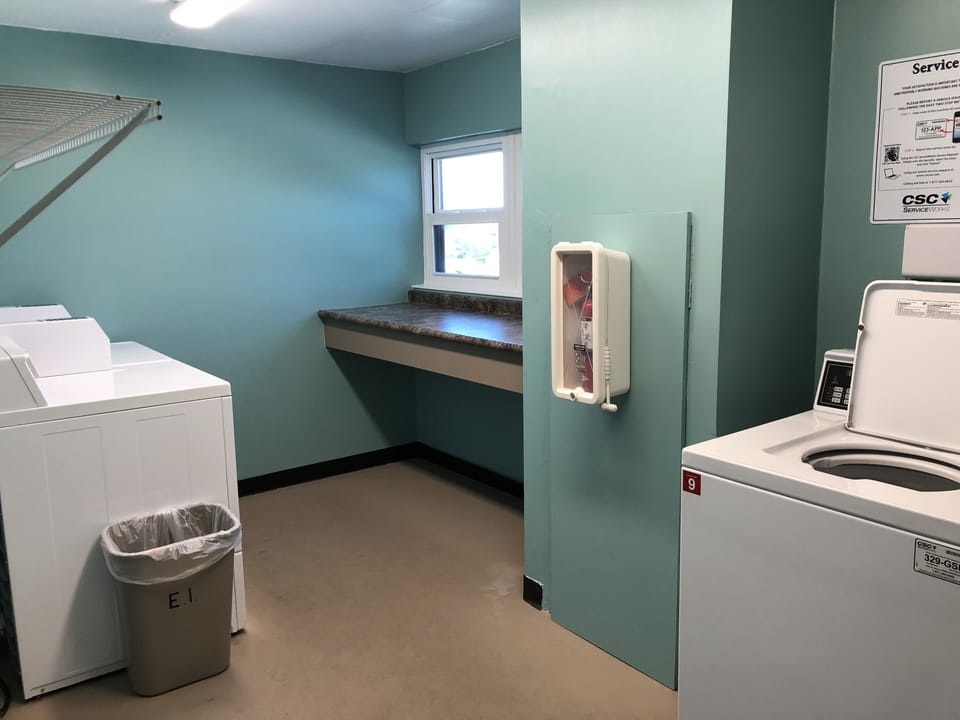 Laundry Room with 2 coin-credit card washers & dryers on each floor of building.