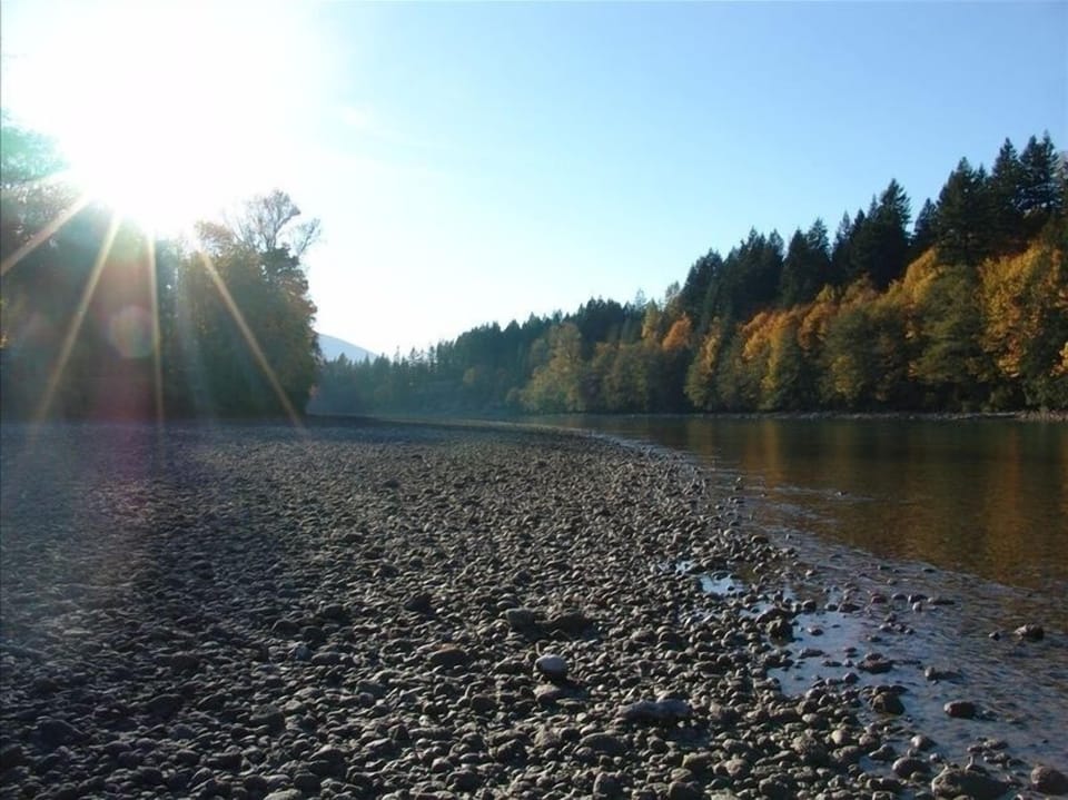 When the river is low, you can walk on the  rocky beach in front of the cottage.