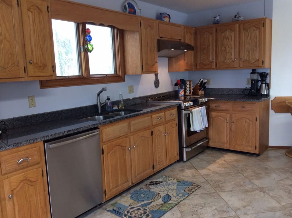 GE Cafe 5-burner stove w/ warming drawer, Bosch dishwasher, 36" stainless sink.