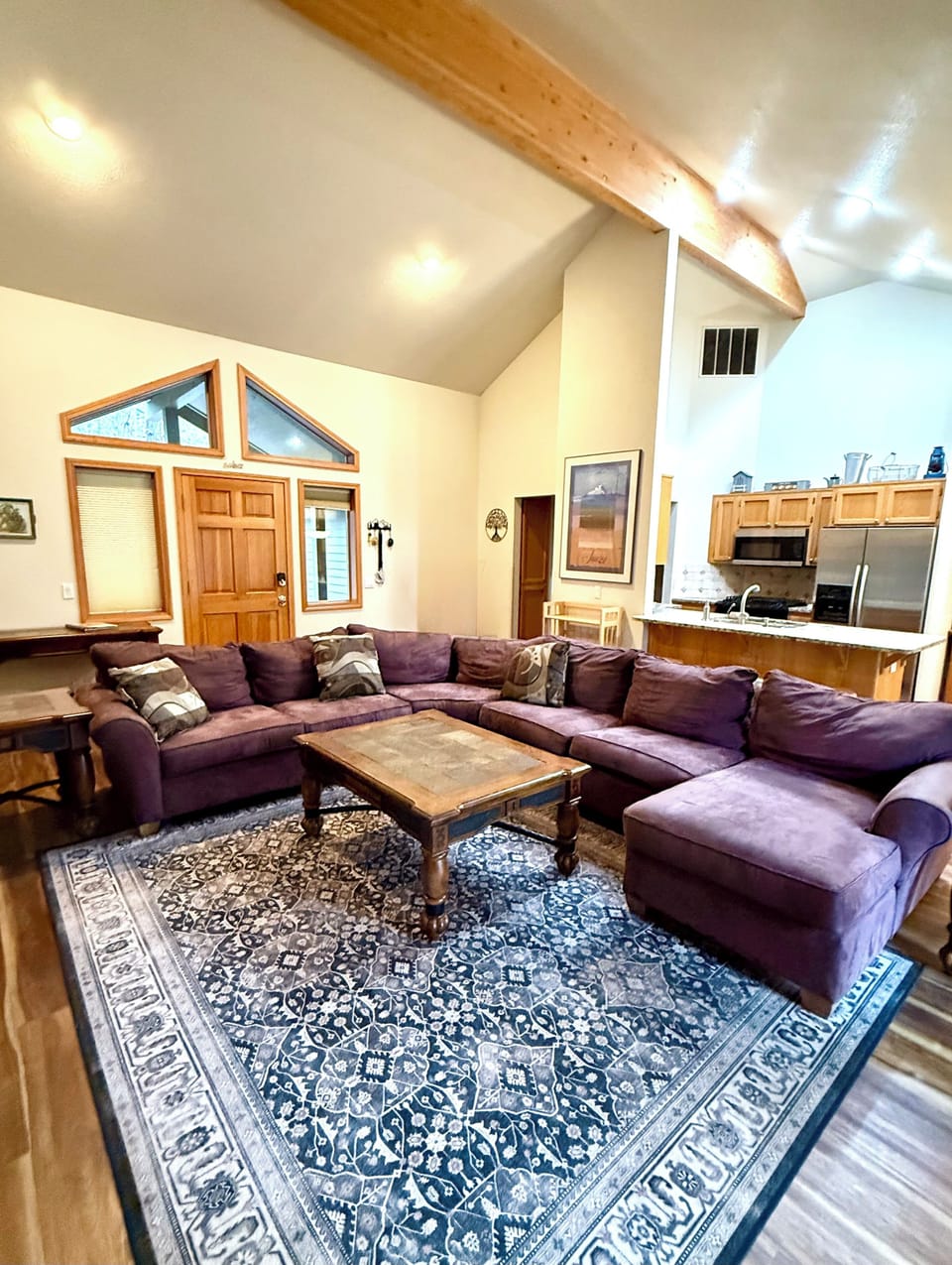 Huge comfy sectional, bright vaulted ceiling, large screen TV &  gas fireplace. 