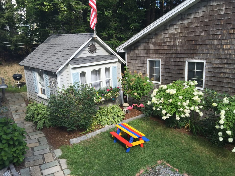 The Dollhouse & our children’s colorful picnic table from Schoodic Point, Acadia