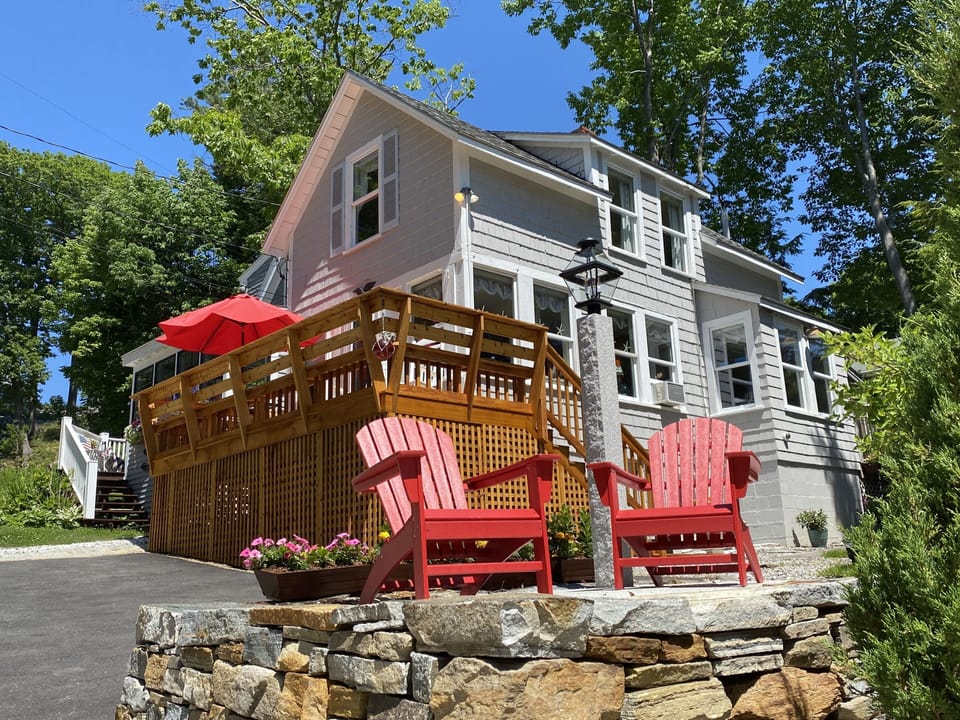 The Getaway-new rock wall, patio, lamp-post & rap-around red cedar deck!  Enjoy!