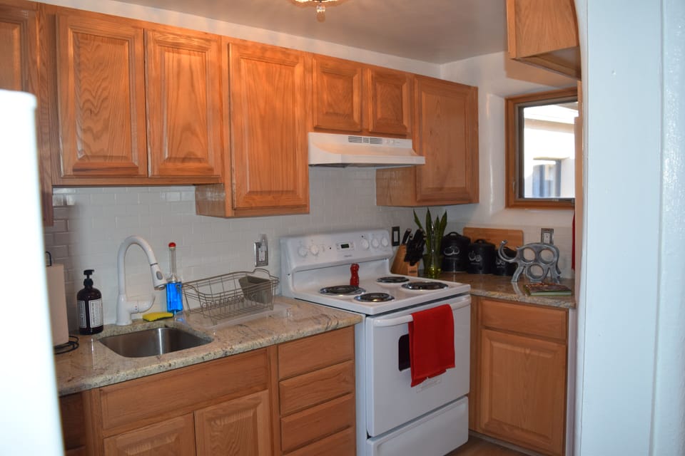 New small kitchen with a small washer/dryer. 