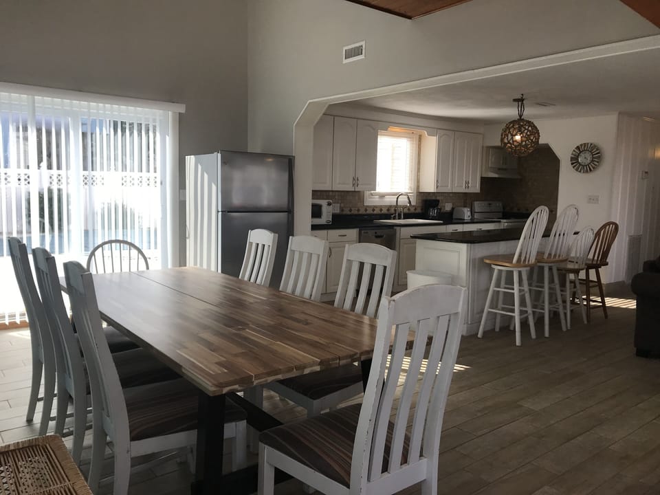 Dining Room Area with Sliding Glass Doors to Outside Living Space