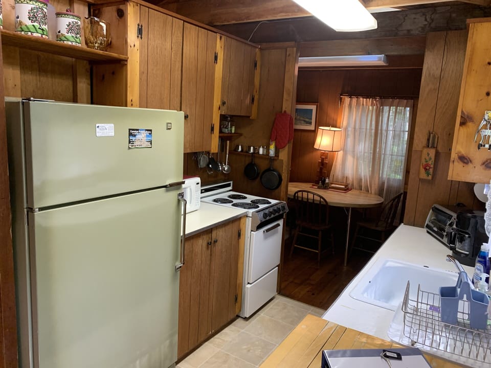 The kitchen has a new stove and new flooring. It is fully equipped.