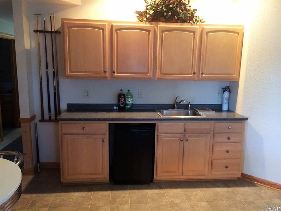Wet bar & mini-fridge in the game room. Easy Access to the Hot Tub.