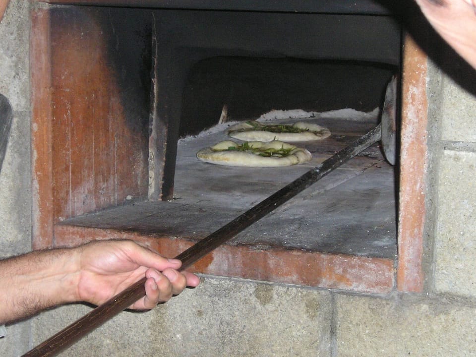 focaccia baking in the brick oven
