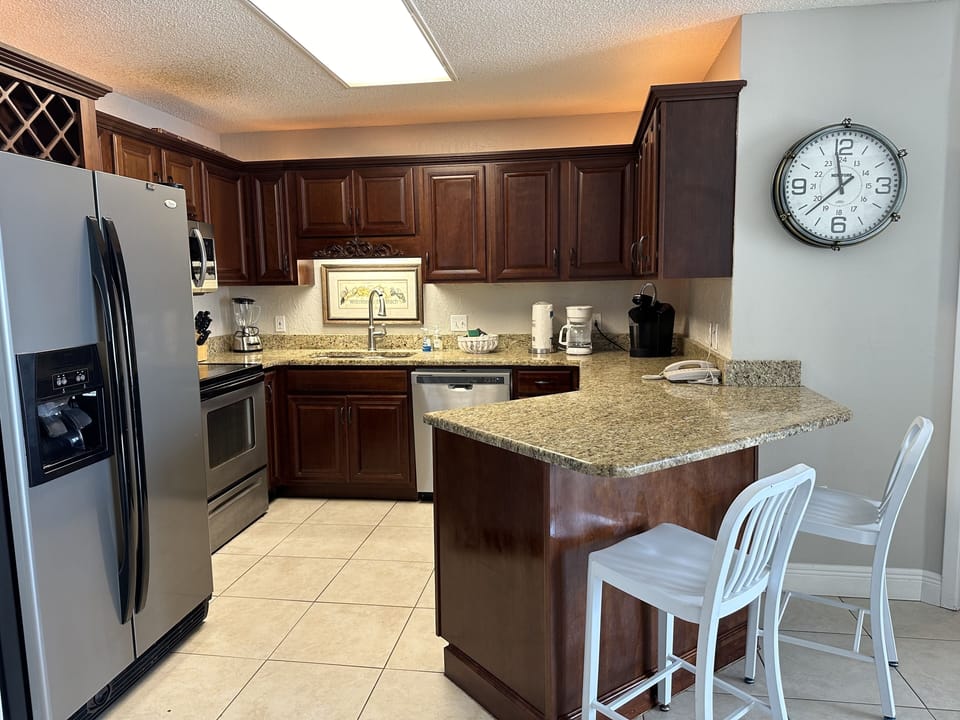 Kitchen and workspace below clock area. 