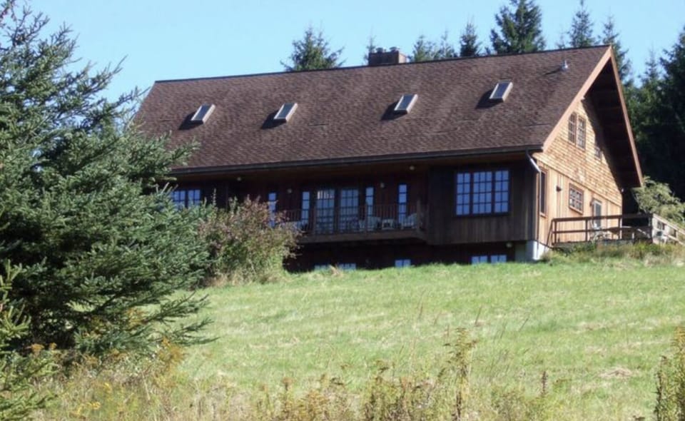 View of covered balcony and deck.