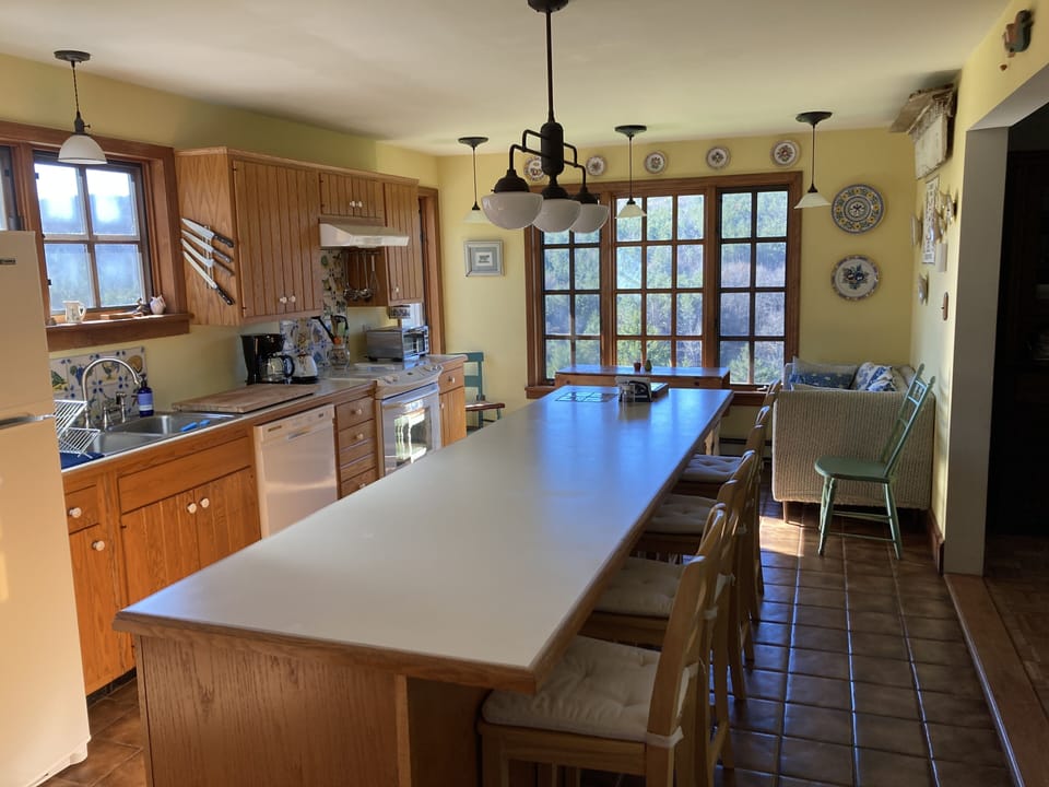 Our fully equipped, sun-filled kitchen is a great space for cooking & eating.