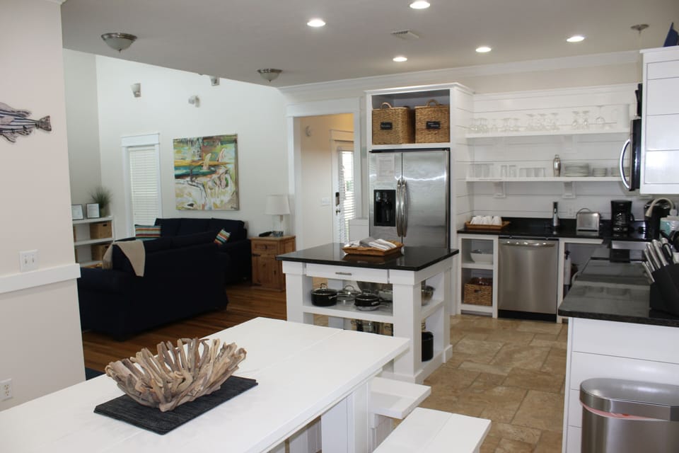 Open concept living, kitchen and dining  - large table with bench seating