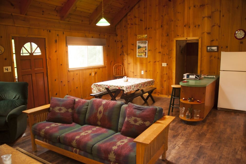 Entrance, dining area, and door to bedroom.
