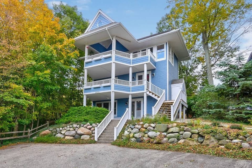 Front of home with multiple decks