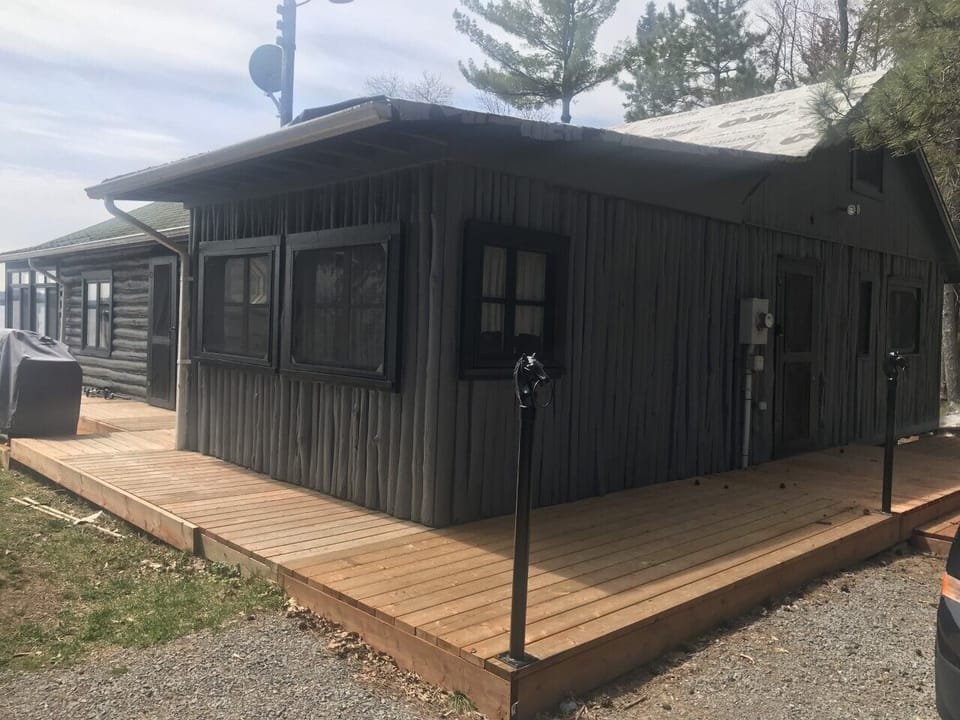 Back entrance to main cottage with wrap around deck (bbq outside kitchen door)