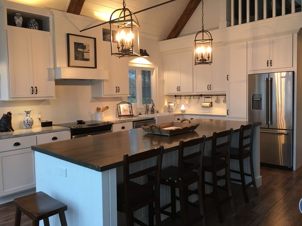 A fully stocked gourmet kitchen that is open to the main level family room. 