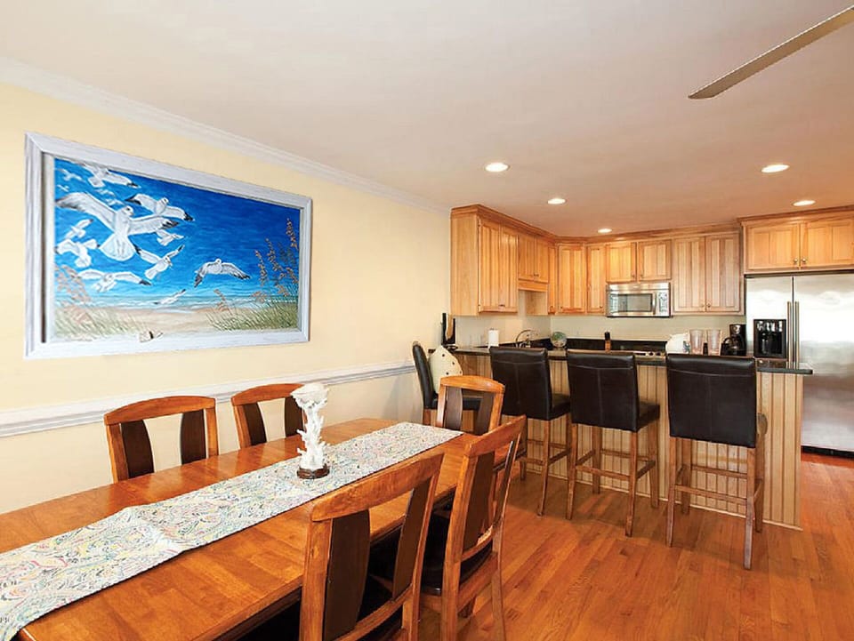 Replaced with New white table and 6 chairs (see next photo).