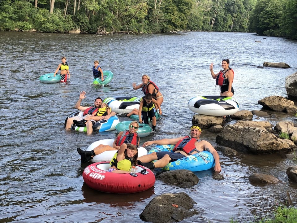 Walk up the river trail and tube down to the lodge