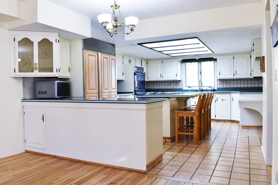 Spacious kitchen with double ovens, Jenn-Aire island cooktop w/ griddle, SubZero