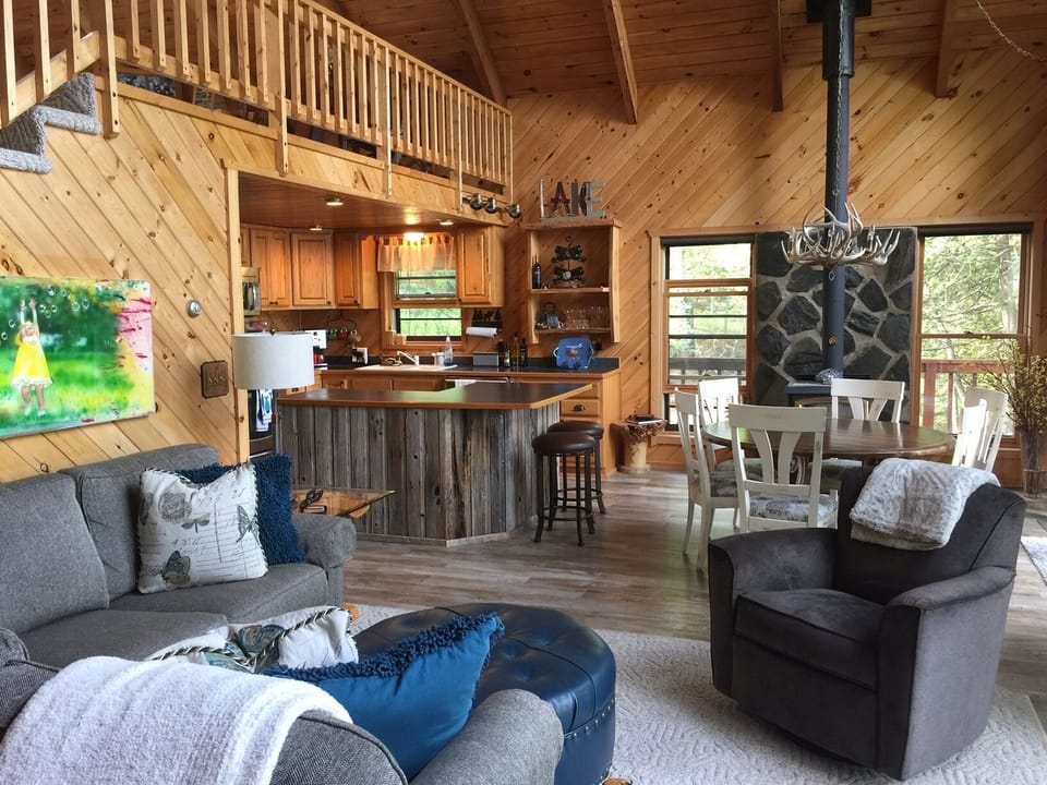 Open living concept for kitchen, dining, and living room facing the lake.